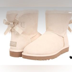 UGG WOMEN’S MINI BAILEY BOW IN “SAND”